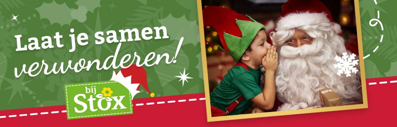 Laat je samen verwonderen bijSTOX – kind als kerstelfje fluistert iets in oor van kerstman